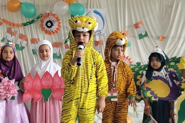 Children in costume on stage at a DAPS Raebareli school programme