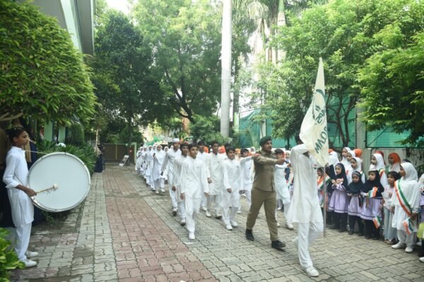 Students of DAPS Raebareli marching with the school band on a road near the campus