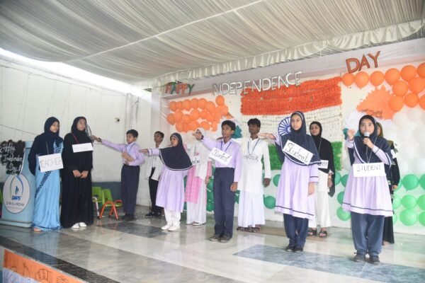 Students receiving certificates on stage at the DAPS Raebareli Independence Day programme