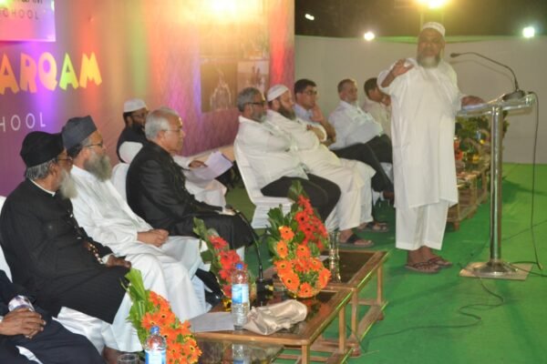 A guest addressing students and parents at a DAPS Raebareli function