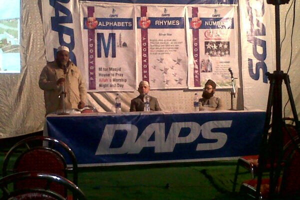 A DAPS Raebareli display stand with early-years learning charts at a school exhibition