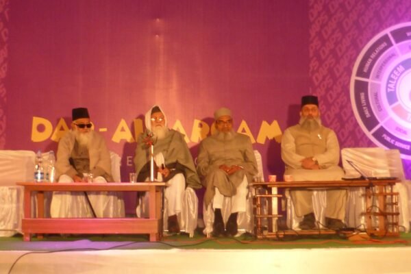 Guests and school management seated on stage at a DAPS Raebareli function